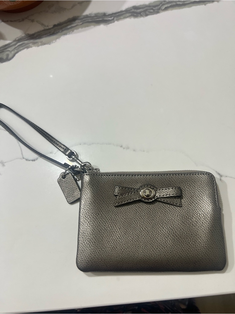 Coach Metallic Silver Bow Wristlet